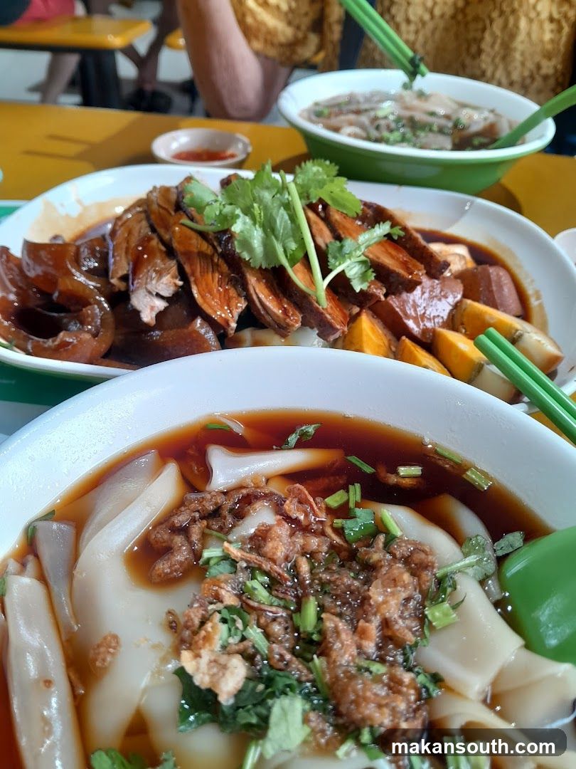 Food Spread with Noodles and Meat Dishes