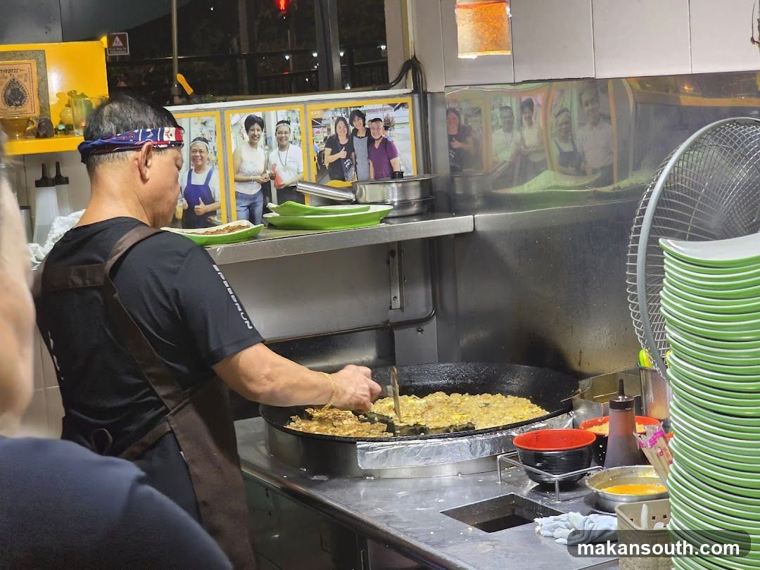 Chef Cooking at Night Market Stall