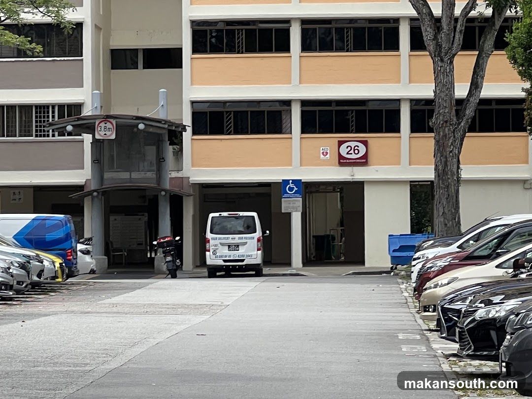 HDB Building Entrance with Parked Vehicles
