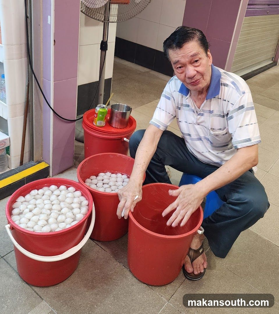 Man with buckets of eggs
