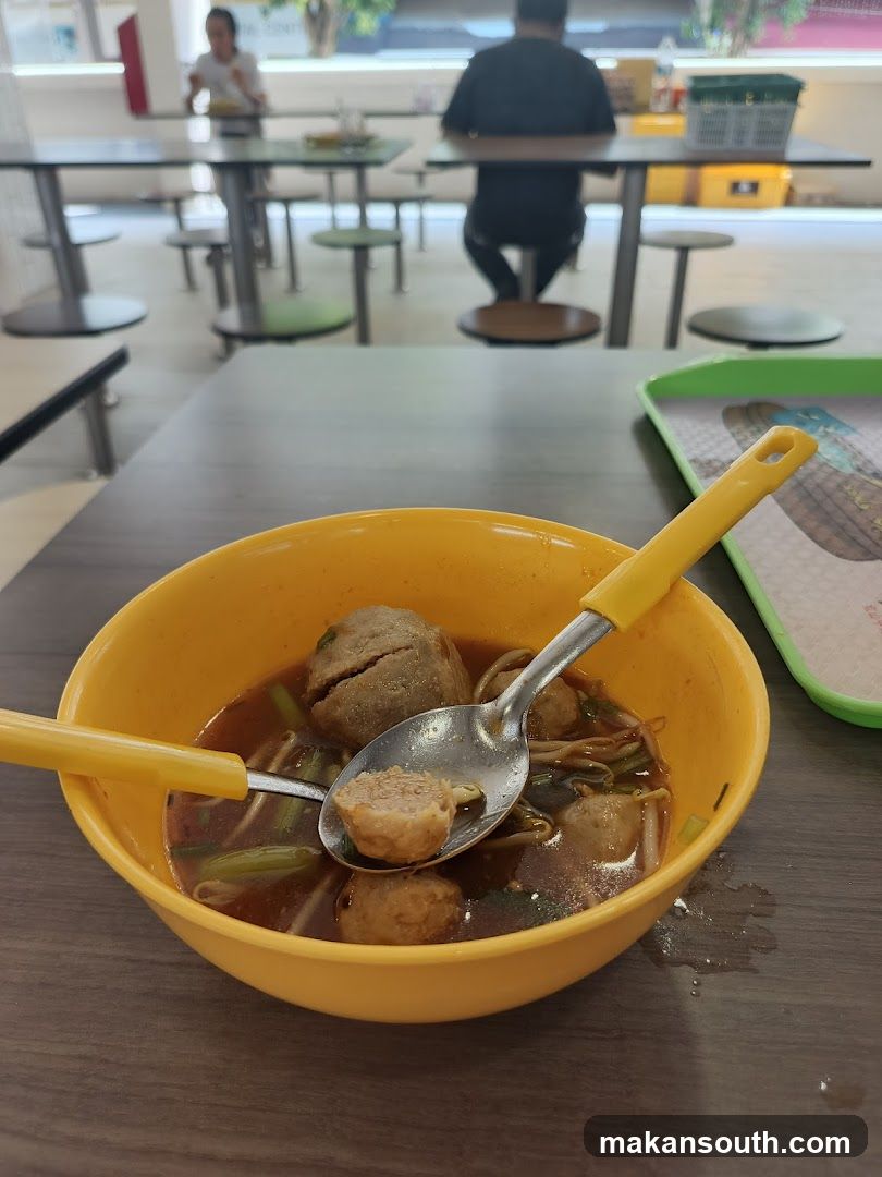 Bowl of Meatball Noodles in Canteen