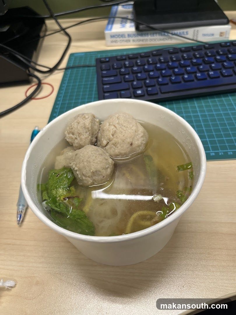 Bowl of Meatball Soup at Desk