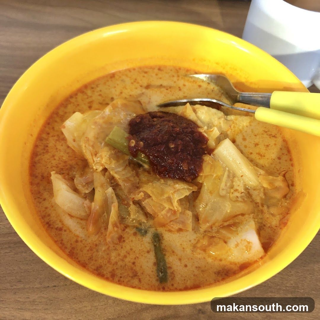 Bowl of Curry with Cabbage and Chili Paste