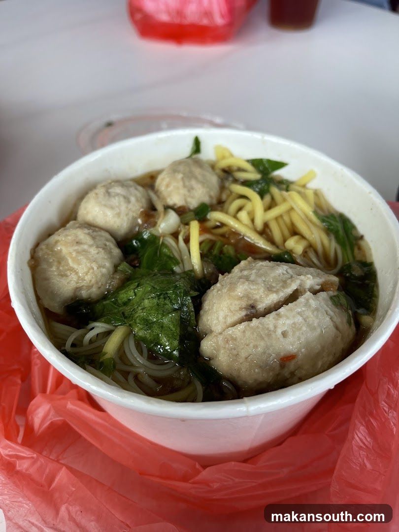 Bowl of Noodle Soup with Meatballs