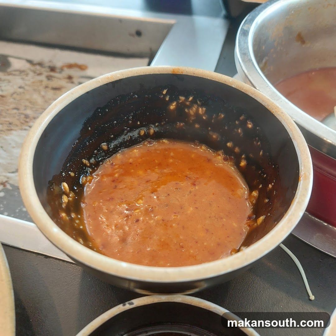 Bowl of Red Sauce with Sesame Seeds