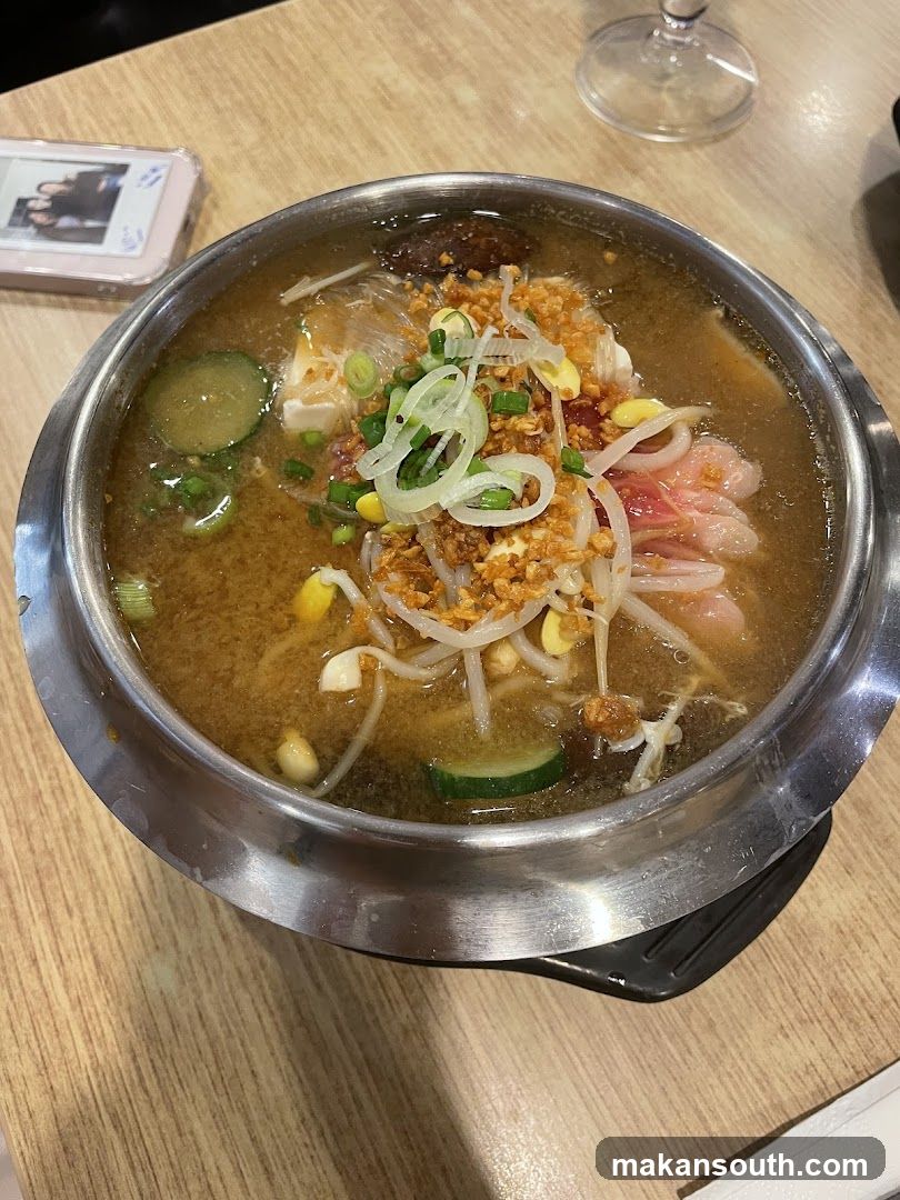 Bowl of Noodle Soup with Toppings