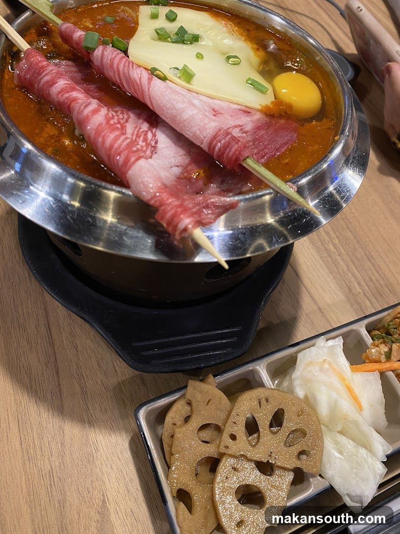 Spicy Hot Pot with Skewered Beef and Sides