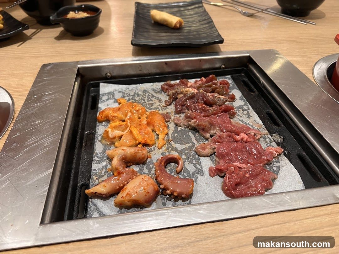 Grilled Meat and Seafood on Hot Plate