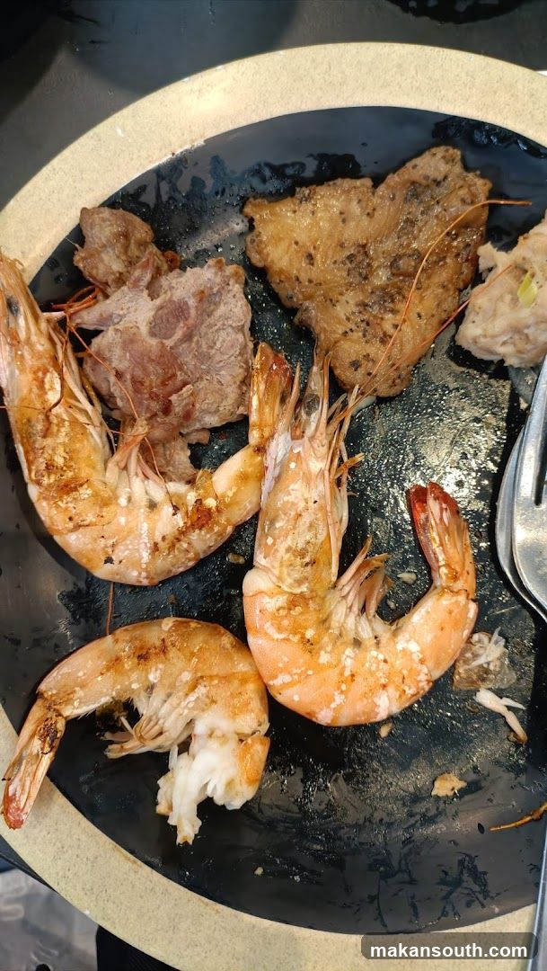 Grilled Shrimp and Meat on a Plate