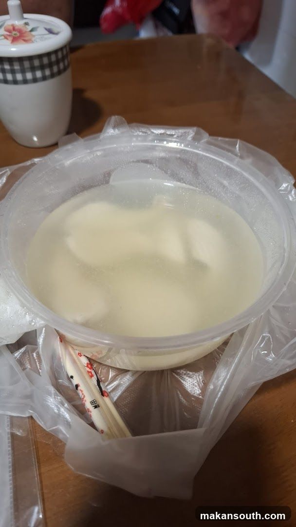 Takeout Bowl of Soup with Dumplings