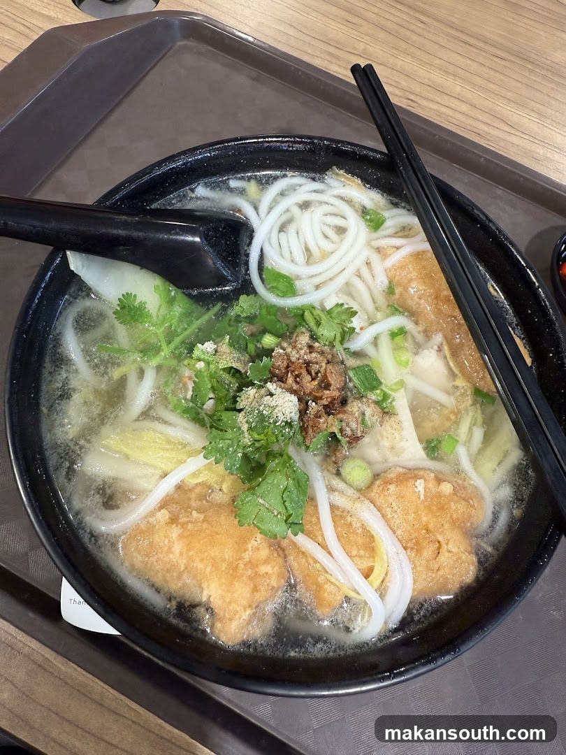 Bowl of Noodle Soup with Fried Dough