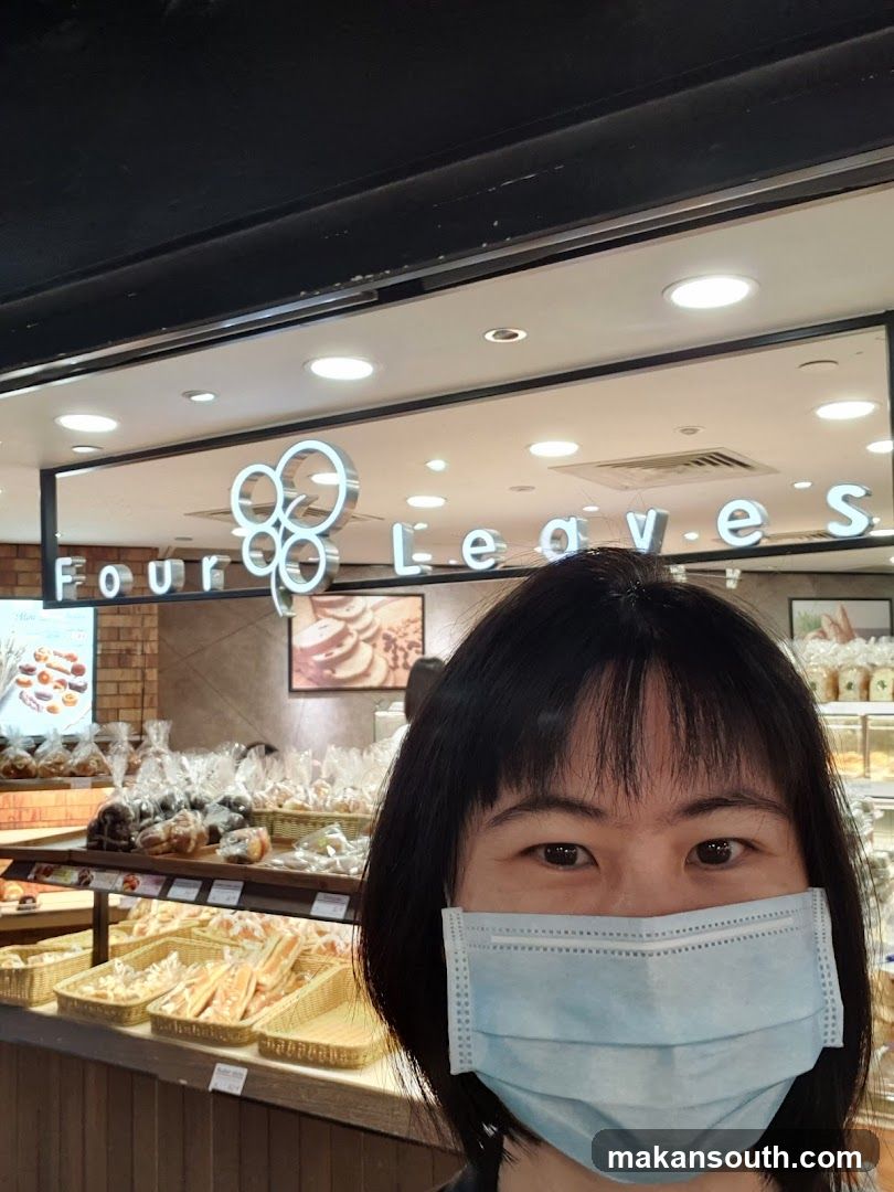 Person in mask at bakery counter