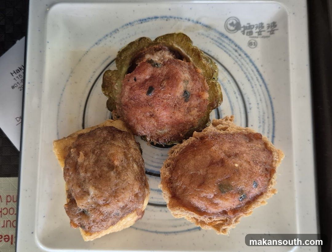Three fried dumplings on a square plate