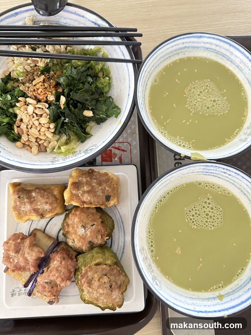 Food Tray with Chinese Dishes and Matcha Drink