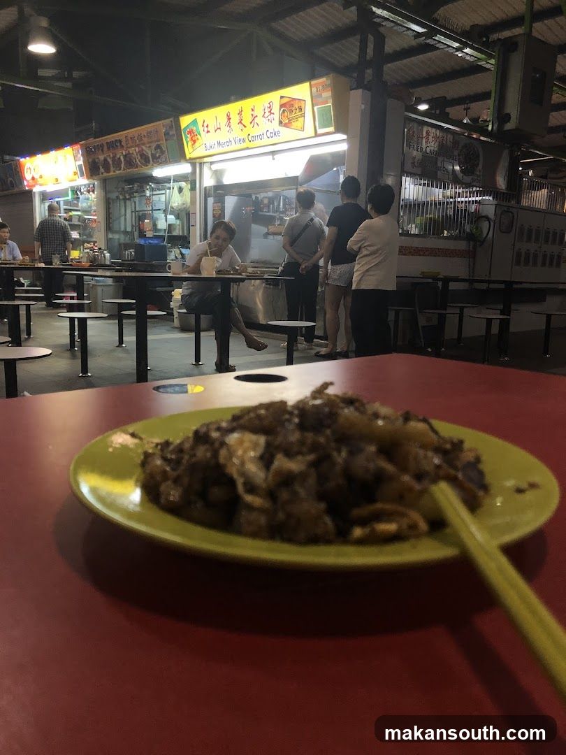 Food stall interior with plate in foreground