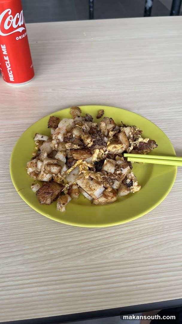 Plate of Fried Rice with Egg and Chicken on Green Plate