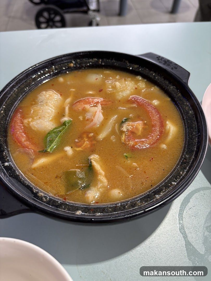 Tom Yum Soup in a Black Pot