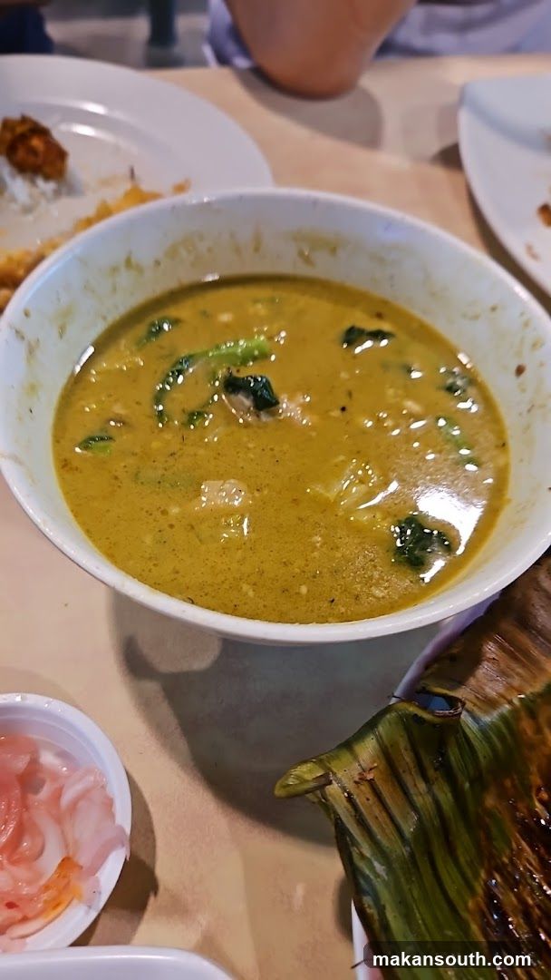 Bowl of Curry Soup with Side Dishes