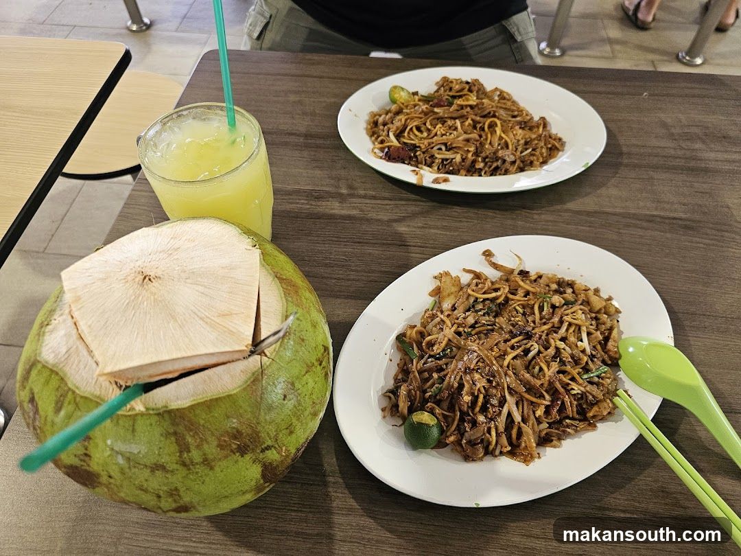 Food Table with Noodles and Coconut Water