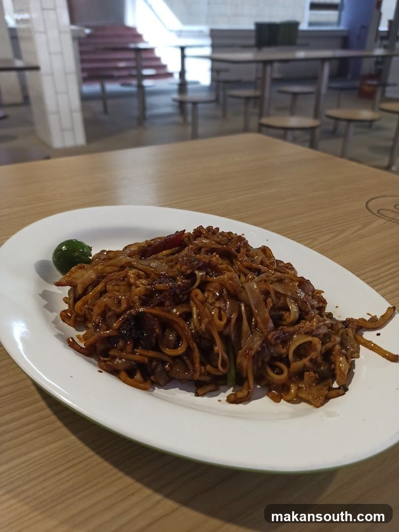 Plate of Stir-fried Noodles with Lime Wedge