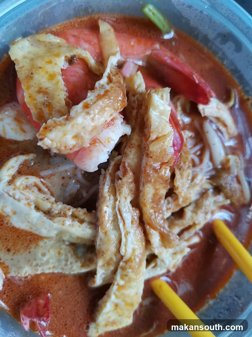 Spicy Noodle Soup with Egg and Tomatoes