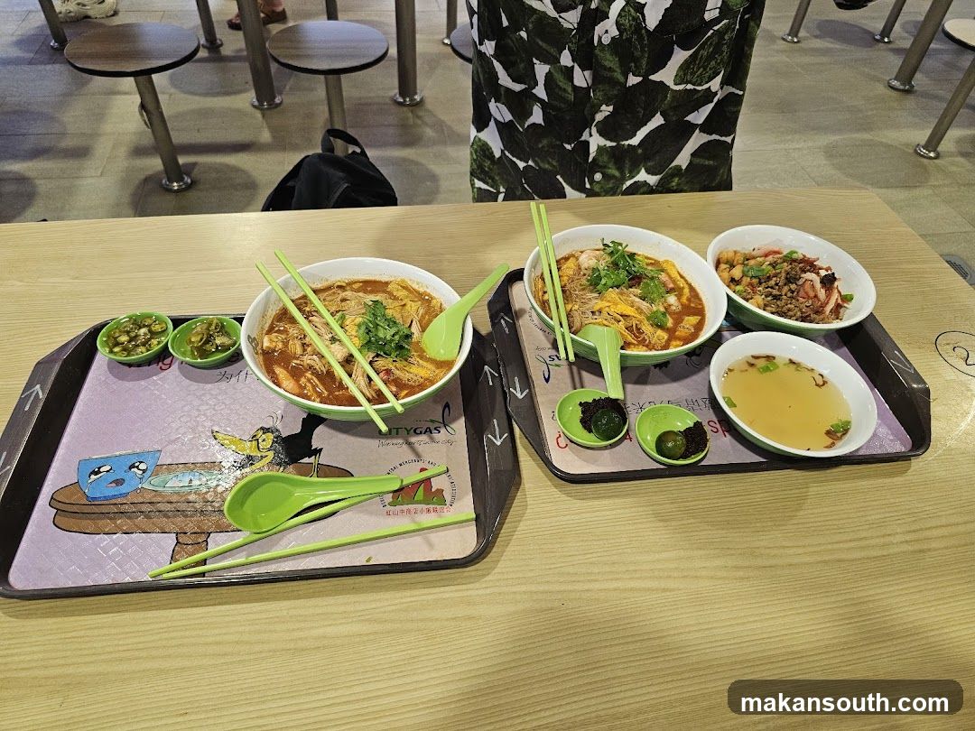 Food Trays with Noodles and Side Dishes