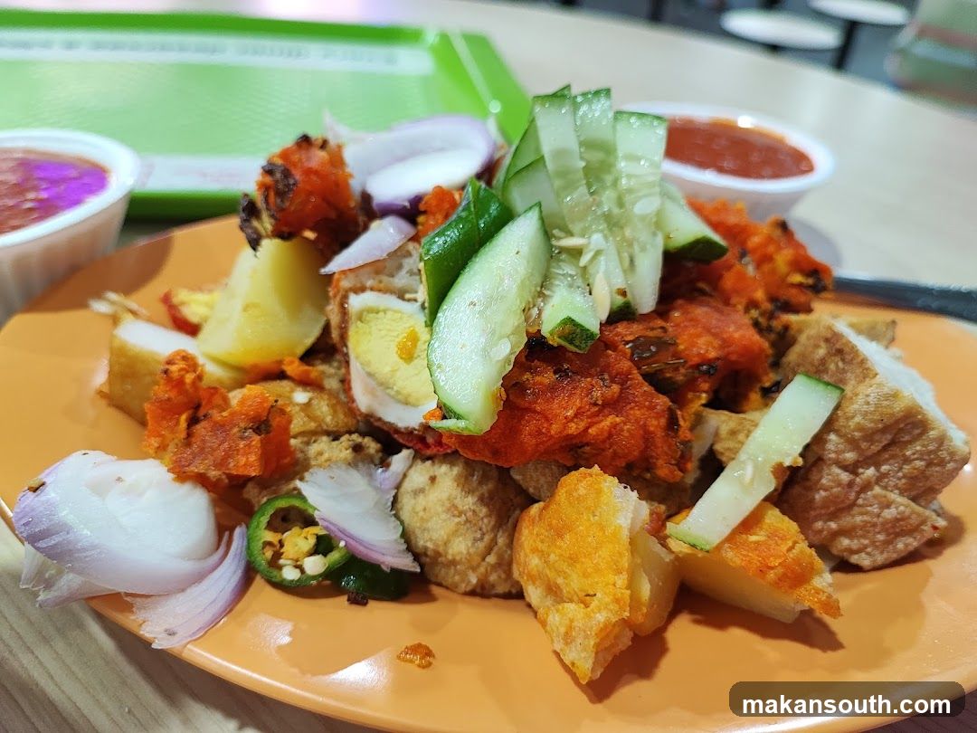 Fried Chicken and Tofu Dish with Cucumber Slices