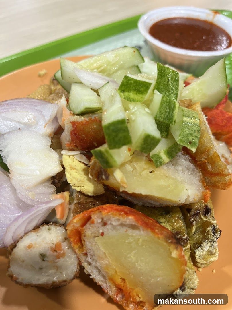 Fried Chicken and Potato Dish with Cucumber Salad