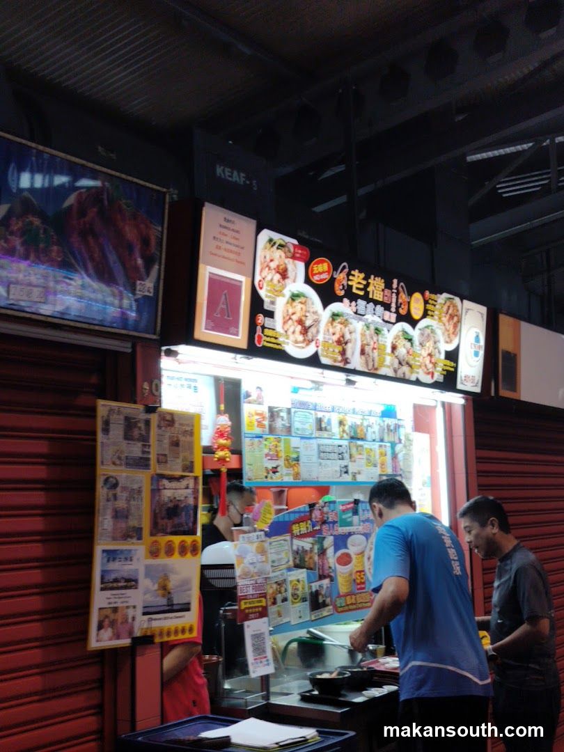 Food Stall Interior with Staff and Posters