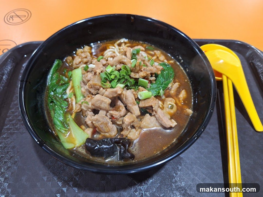 Bowl of Noodle Soup with Meat and Vegetables