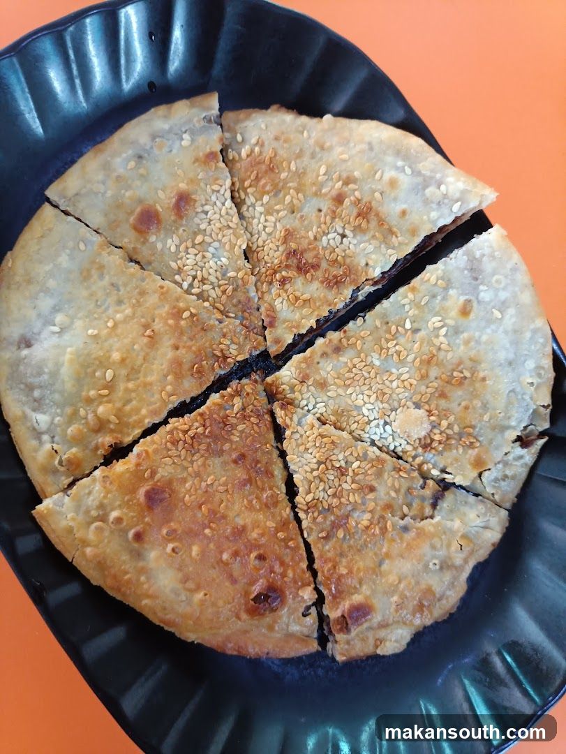 Sesame Seed Pastry on Black Plate