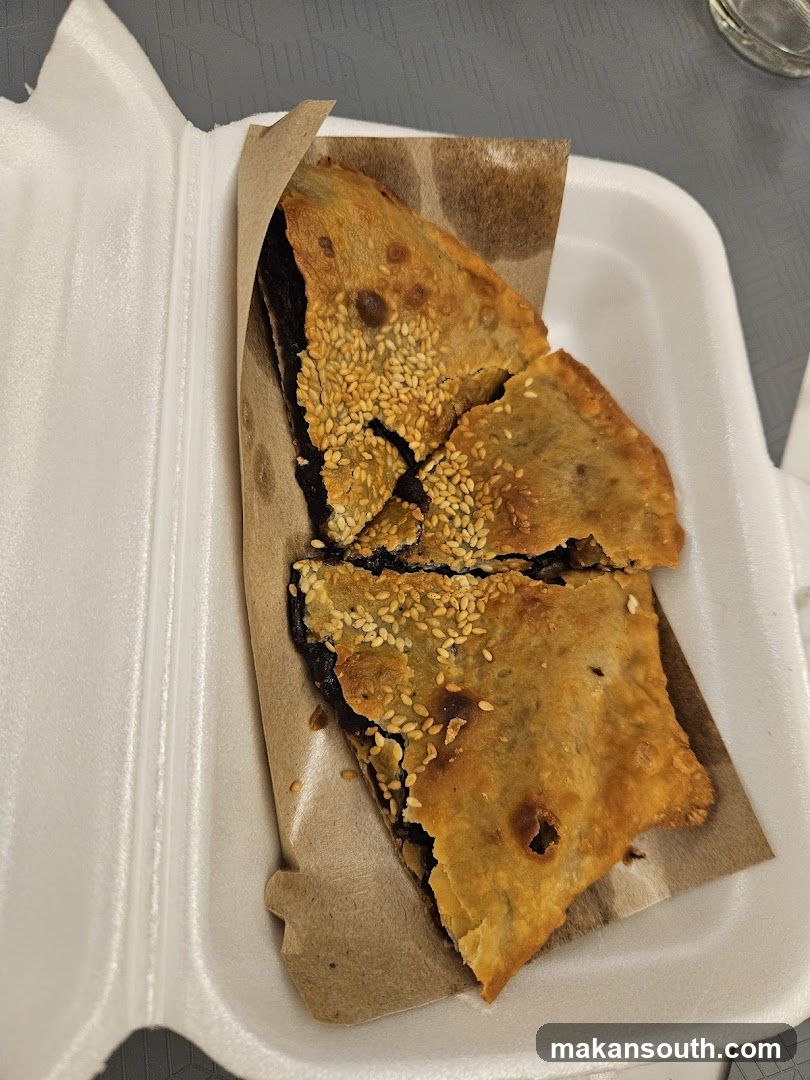 Sesame Crusted Pastry in Takeout Container