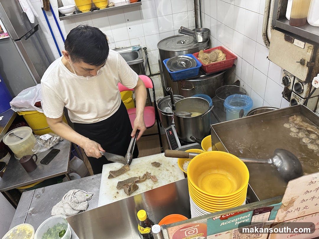 Kitchen Interior with Chef Preparing Food