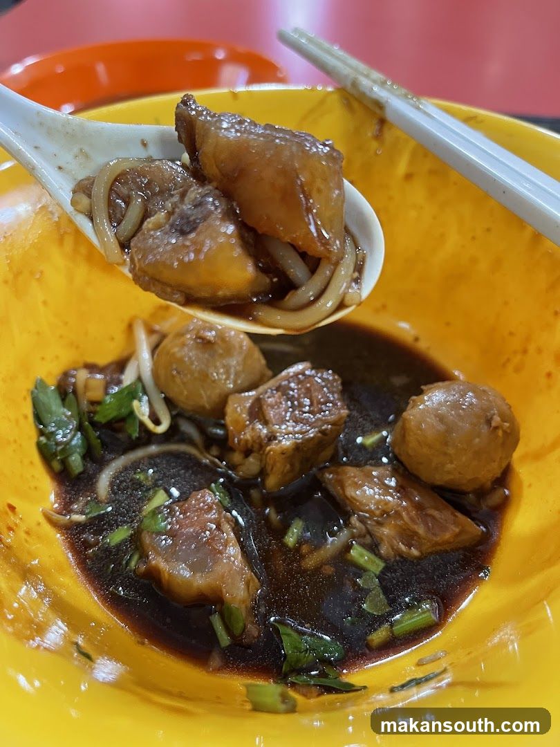 Bowl of Noodle Soup with Meatballs and Vegetables