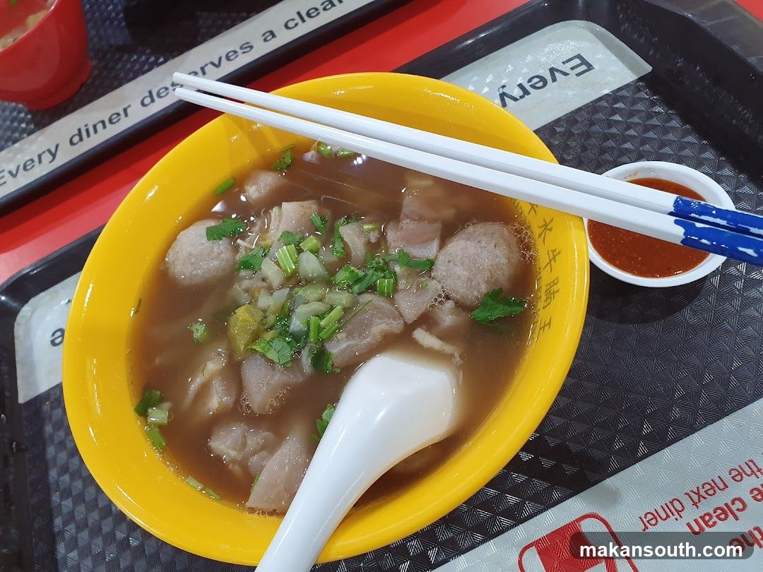 Bowl of Soup with Chopsticks and Sauce