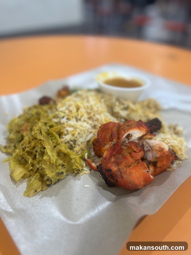 Plate of Indian-style food with rice and curry