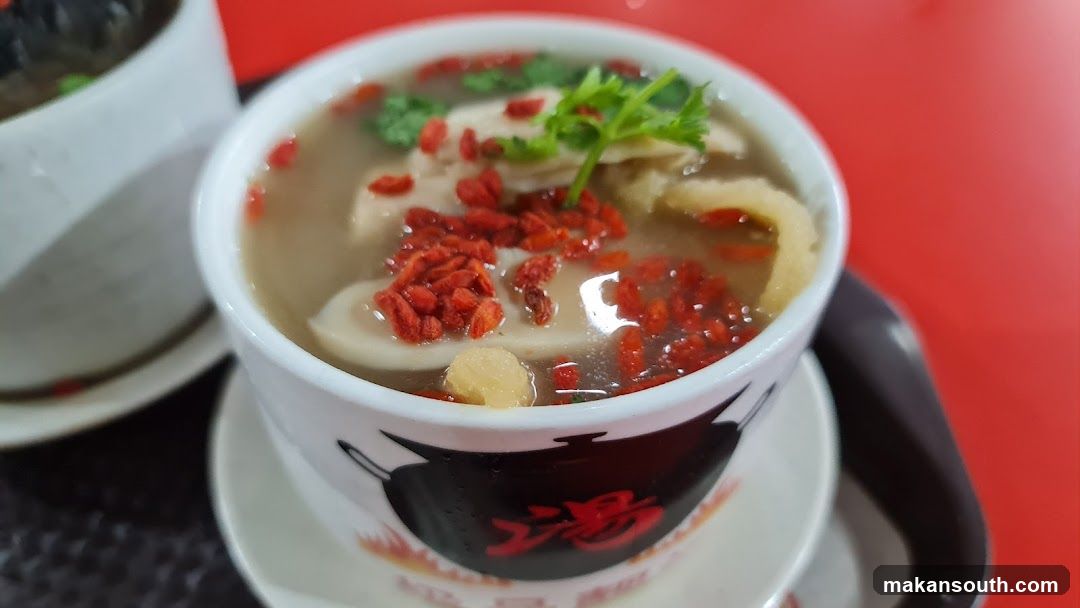Bowl of Soup with Goji Berries and Meat