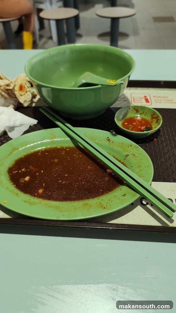 Used food tray with green bowl and plate