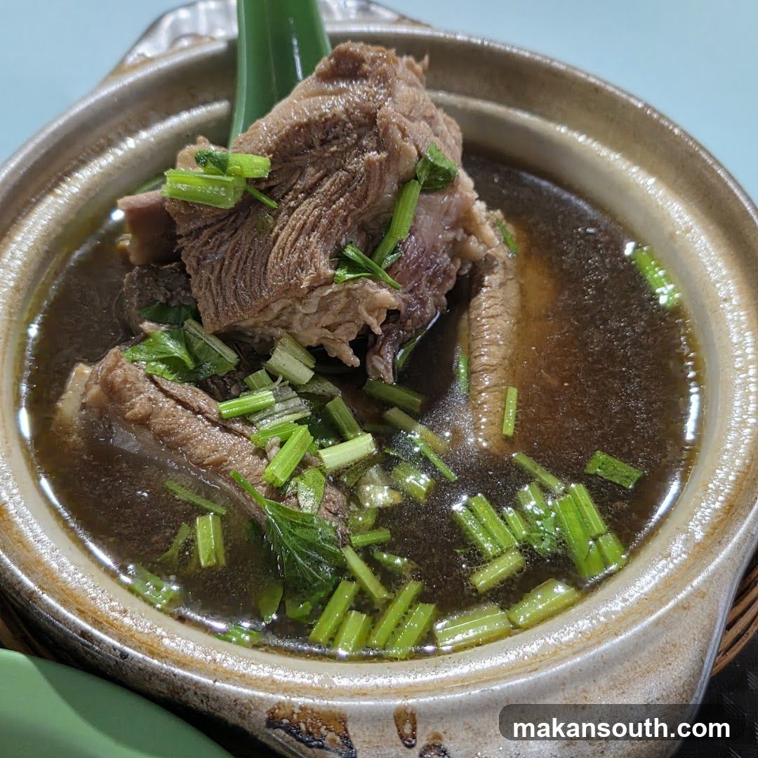 Pot of Beef Soup with Scallions