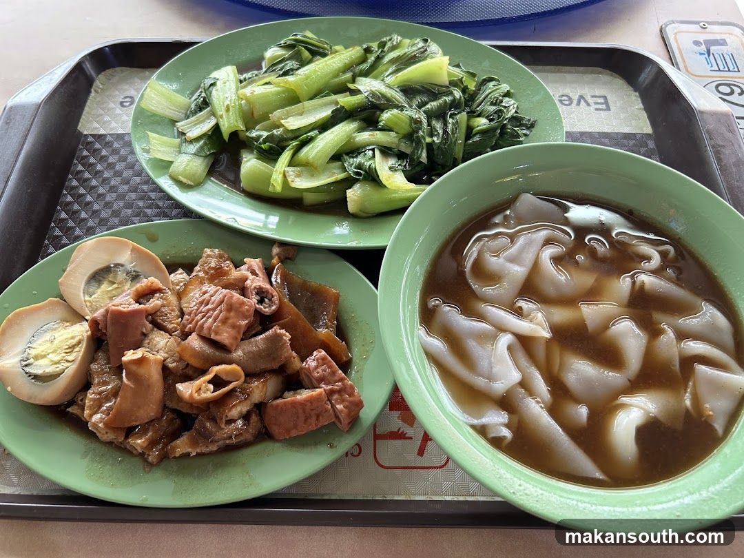 Cantonese-style food tray with noodles and braised offal