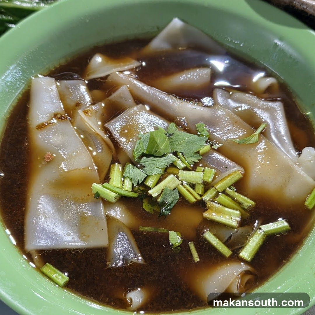 Bowl of Noodle Soup with Garnish
