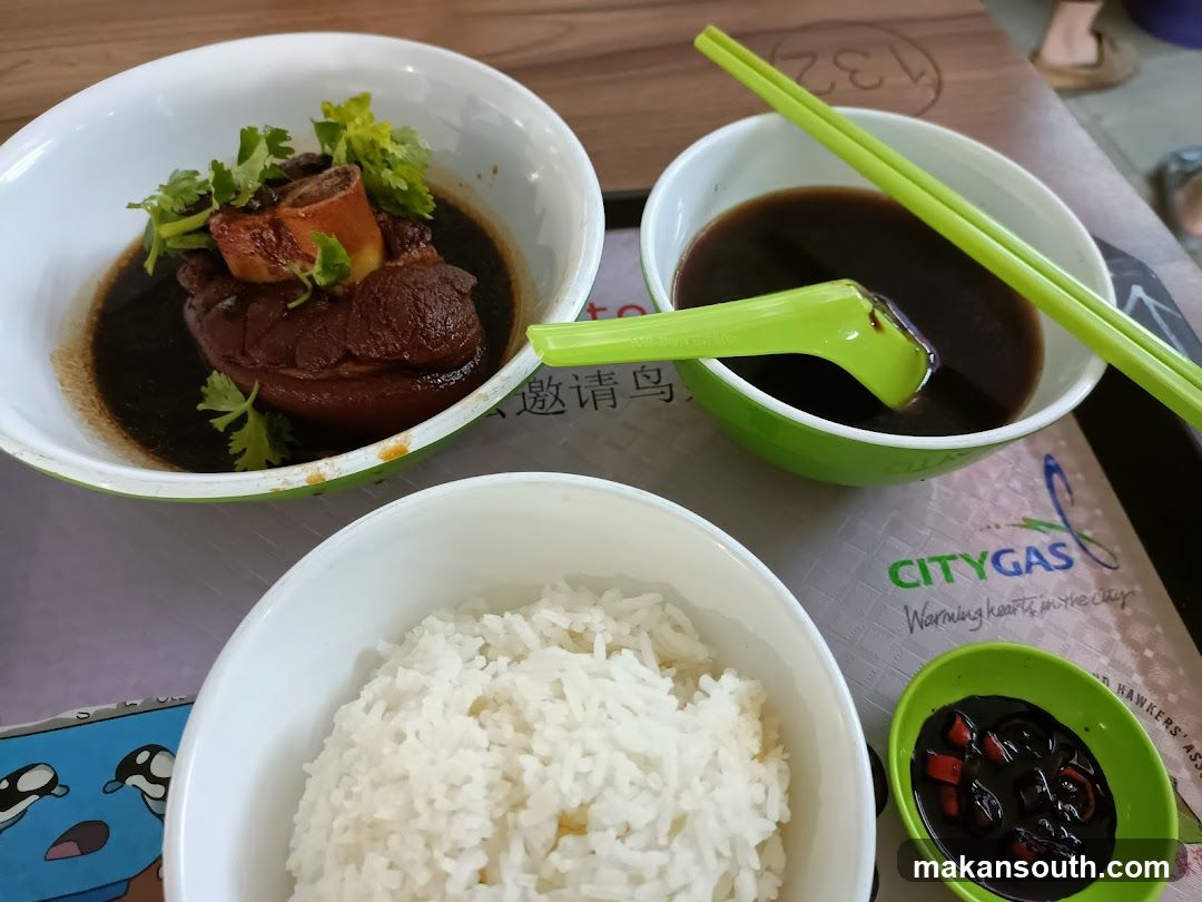Bowl of food with rice and sauce
