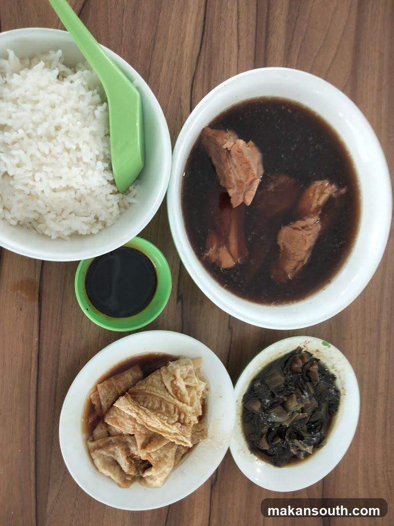 Bowl of food with rice and soup