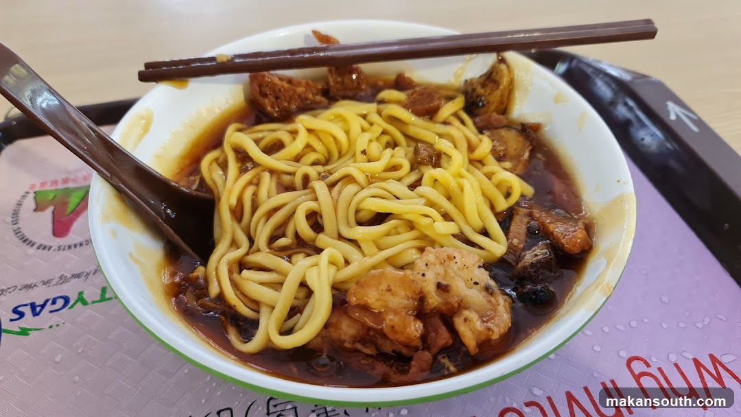 Bowl of Noodles with Chopsticks and Spoon