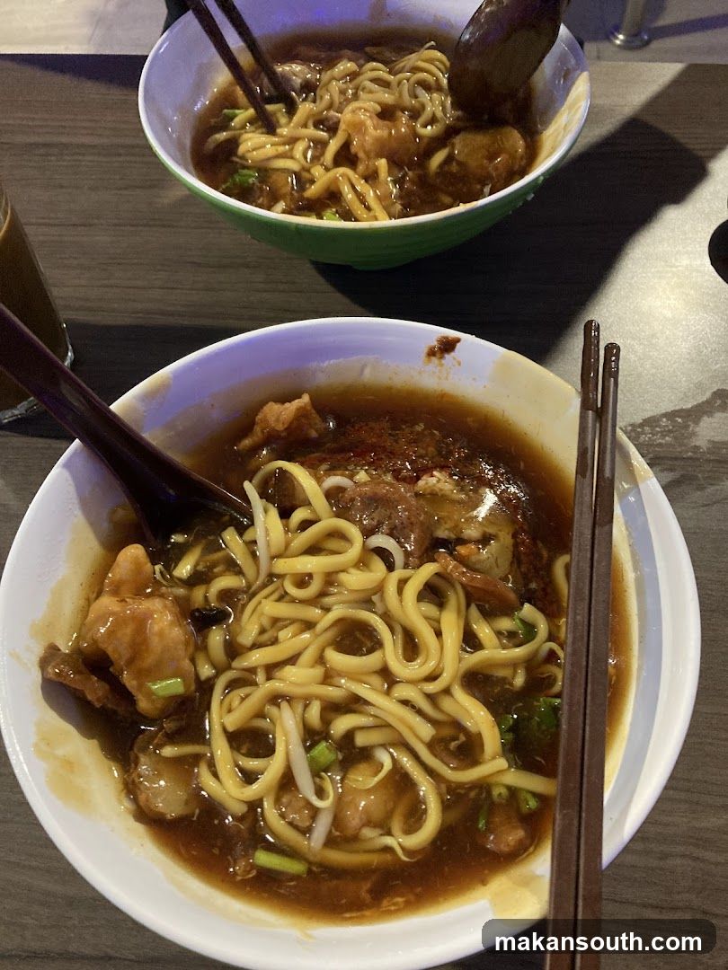 Noodle Bowl with Chopsticks and Spoon