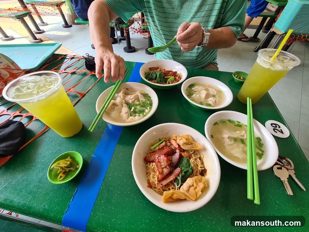 Food Table with Noodles and Drinks