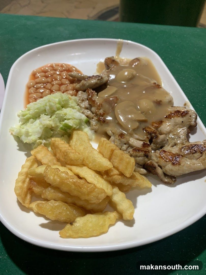 Plate of Chicken with Gravy, Fries, Baked Beans and Coleslaw
