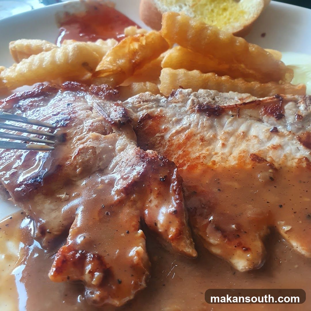 Grilled Pork Chop with Sauce and Fries