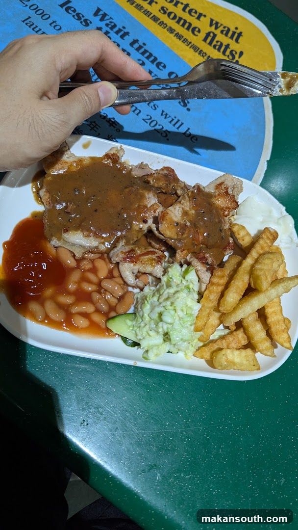 Plate of food with beans, fries, and meat