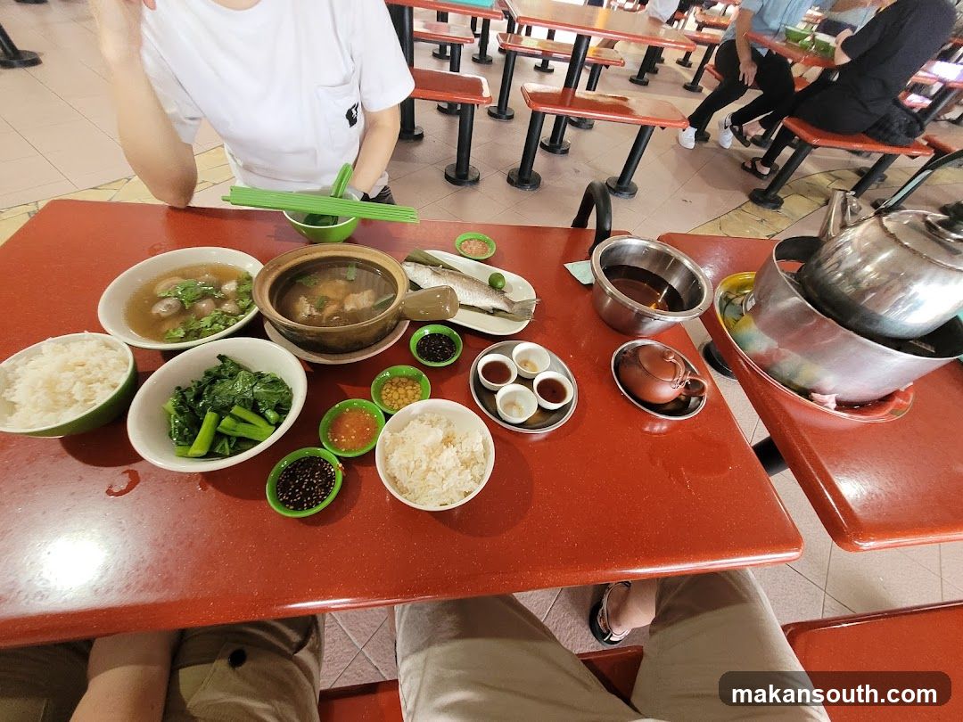 Food Table with Hot Pot and Side Dishes